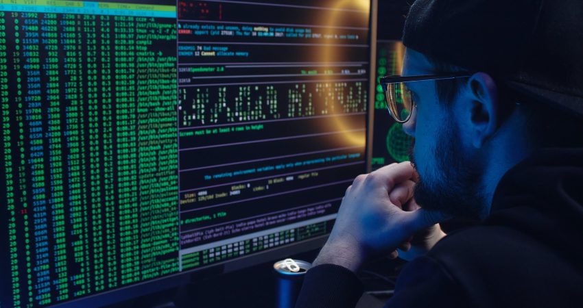 Free A Man Looking at a Computer Screen with Data Stock Photo